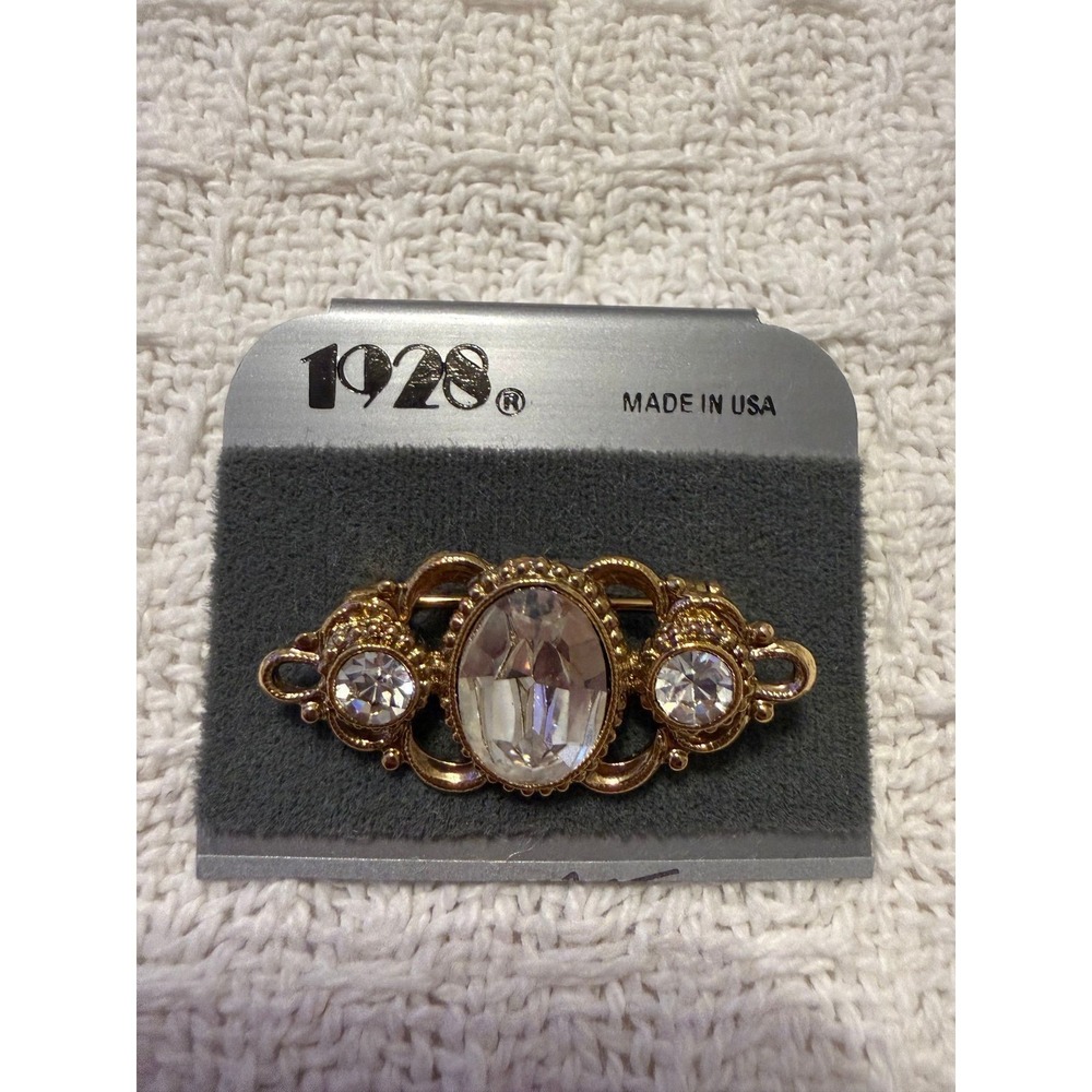 Jewelry Co. Victorian-style gold-tone bar brooch w/ a large oval crystal center